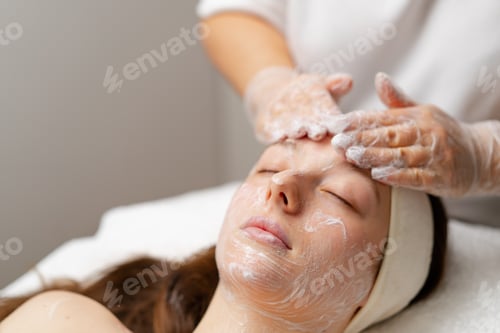 Preview: cosmetic procedure to rejuvenate the skin of the face patient in a cosmetology clinic doctor does be