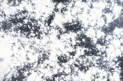 Preview: Abstract Background of Floured Black Slate Surface. Top View, Flat Lay.