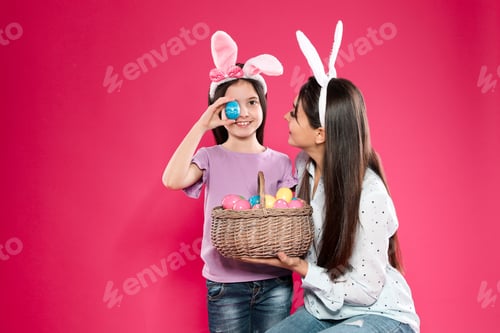 Preview: Girl and Woman Celebrate Easter with Colorful Eggs