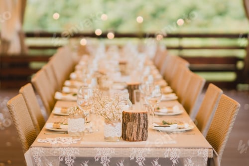 Preview: Table setting at the wedding reception. Floral compositions with beautiful flowers and greenery, can