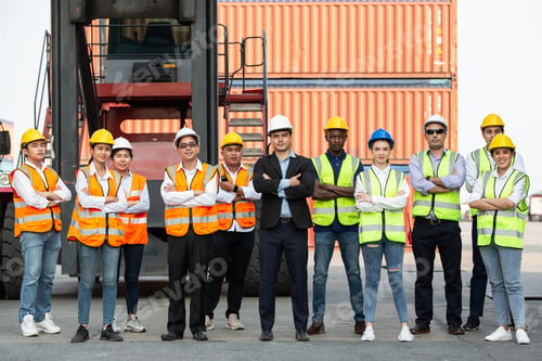 Preview: Successful logistic worker team standing at container warehouse