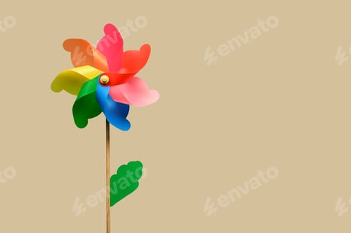Preview: Colorful rotating pinwheel against beige background
