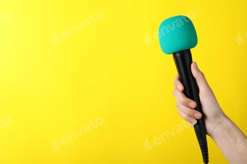 Preview: Woman holding microphone on color background, space for text