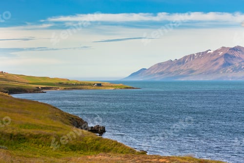 Preview: Icelandic Coastline landscape under a blue summer sky