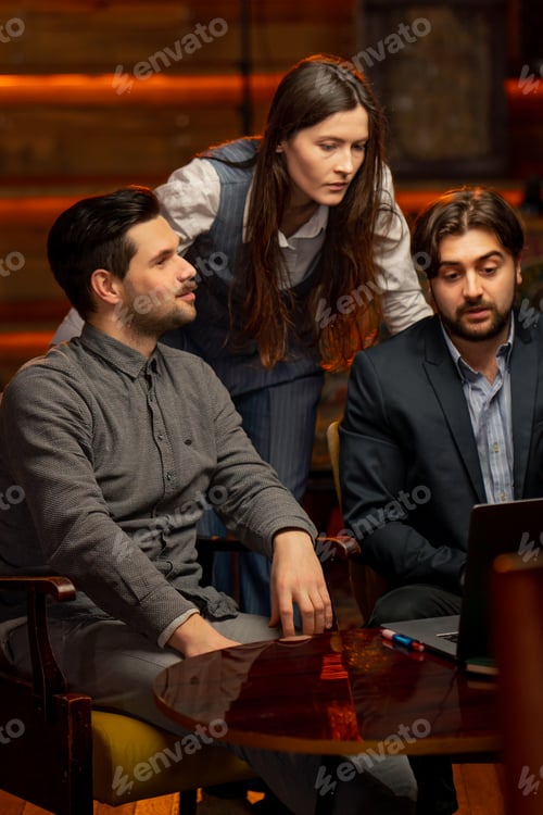 Preview: office sitting in yellow chairs two male workers discuss a project with a female director scolding