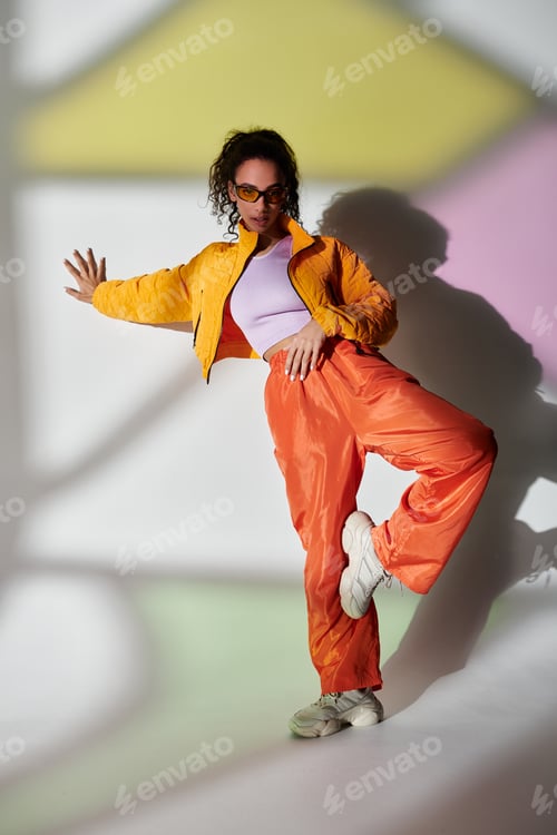 Preview: A burst of color: fashionable girl in studio