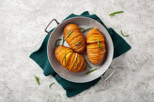 Preview: baked hasselback potato with cheddar cheese and rosemary