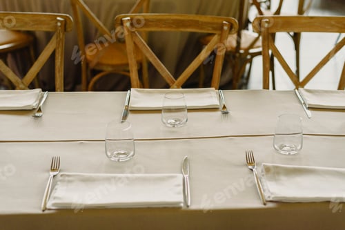 Preview: Empty lounge of a restaurant with tables, chairs and retro cutlery.
