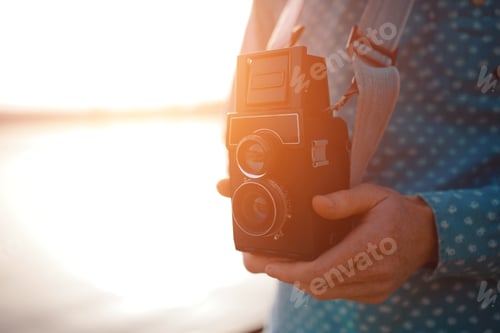 Preview: The red-haired guy holding a medium format film camera in his hands