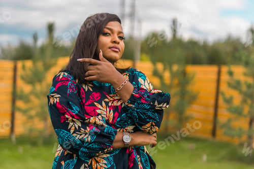Preview: Portrait of beautiful african american woman having fun on village or suburbian. Outdoor portrait of