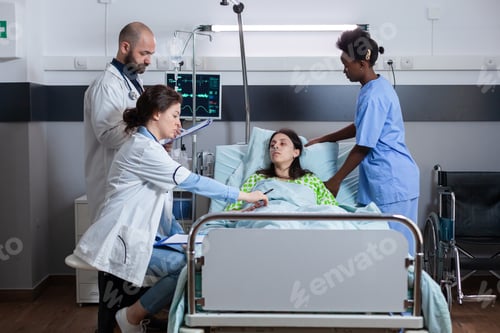 Preview: Practitioners doctors monitoring sick woman writing sickness treatment