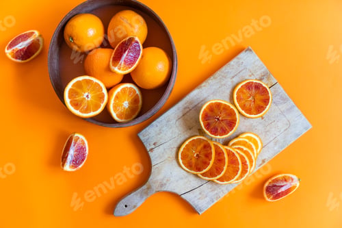Preview: Fresh juicy oranges on colorful background