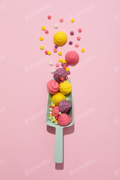 Preview: Jelly candies in scoop on pink background, top view