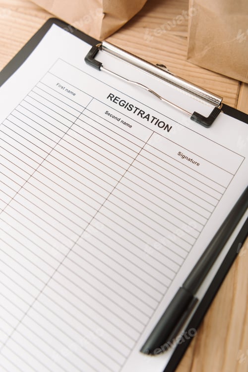 Preview: close-up shot of blank registration form on clipboard