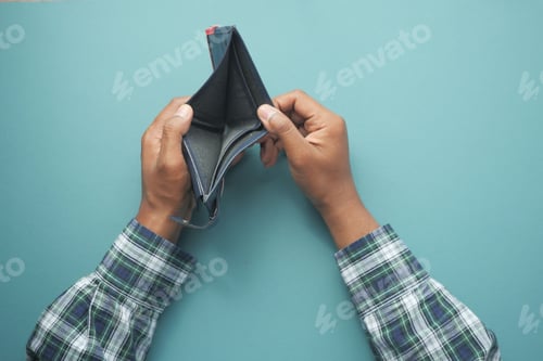 Preview: Man hand open an empty wallet with copy space.