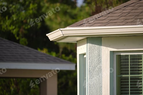 Preview: Closeup of house roof top covered with asphalt or bitumen shingles. Waterproofing of new building