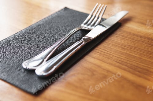 Preview: Fork and knife on the table in restaurant
