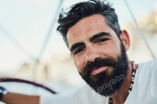 Preview: Bearded guy know how to chill. Cropped shot of a handsome mature man on his yacht.