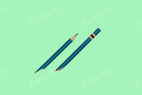 Preview: The Pencil Is Broken Lying On A Light Background Isolated