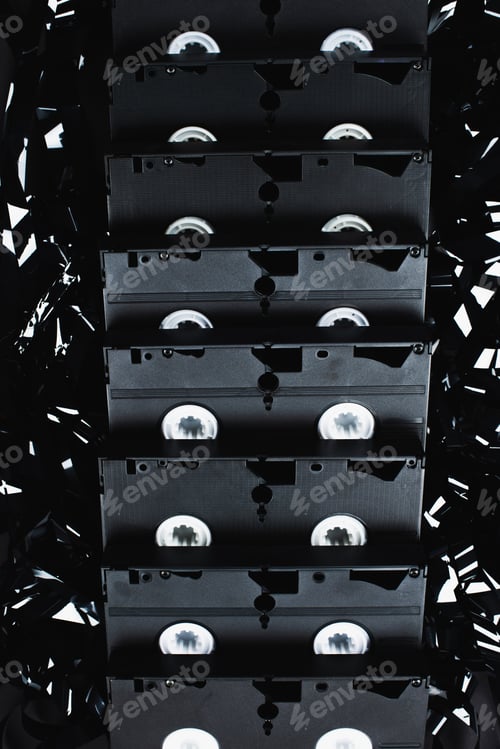 Preview: Top View of VHS Cassettes on Black Film Strip