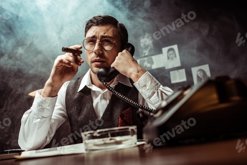 Preview: Detective in glasses holding cigar and talking on telephone in dark office