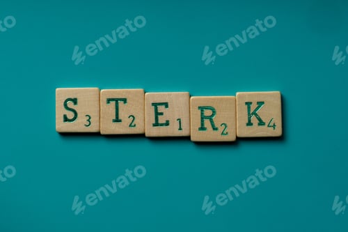 Preview: Wooden letters spelling the word sterk (dutch for strong) on a blue background.