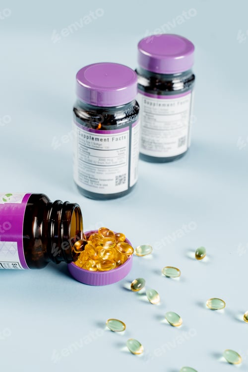 Preview: Vitamin D jar with omega-3 fish oil capsules close-up