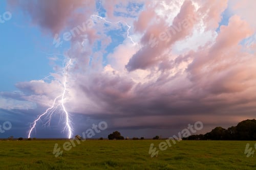 Preview: Scenic view of beautiful lightning over the field