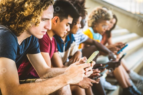 Preview: Group of young people using smart mobile phone device together