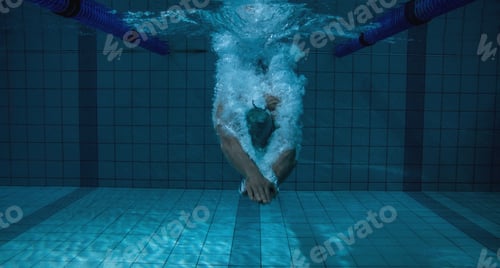 Preview: Fit swimmer training on his own in the swimming pool at the leisure centre
