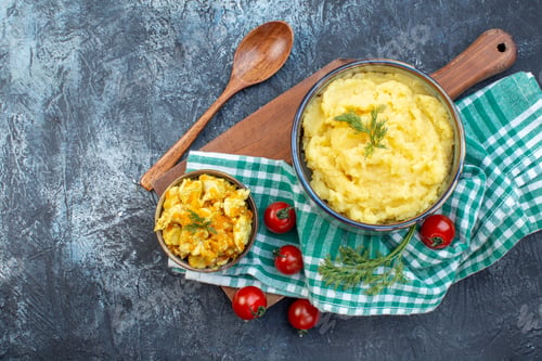 Preview: Top view of mashed potatoes served with dill and delicious dish fresh tomatoes on green stripped