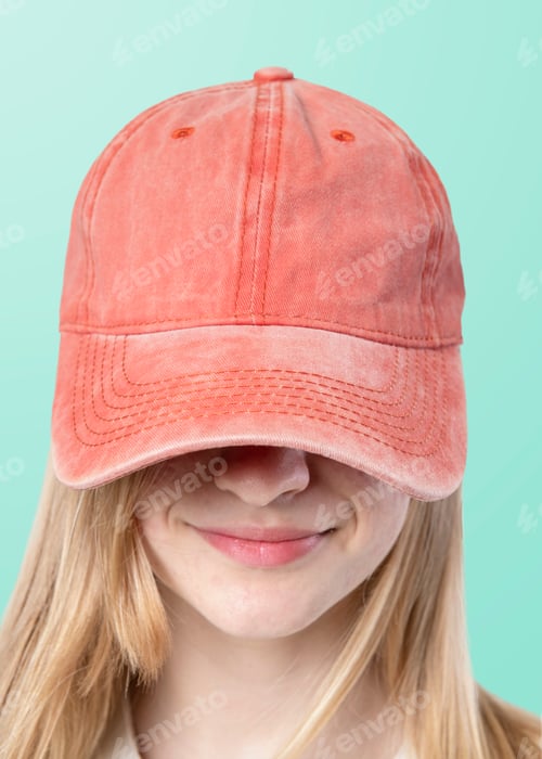 Preview: Happy woman wearing a red cap