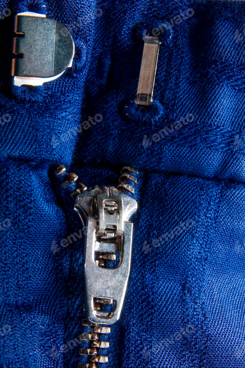 Preview: Fragment of blue jacket with metal zipper. ziplock background. Close up.