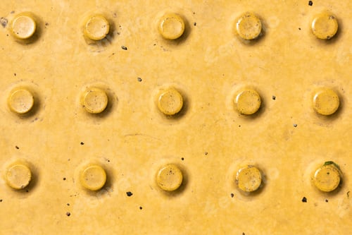 Preview: close-up view of yellow rough weathered metal background