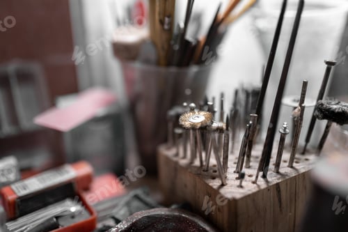 Preview: Some drill metal brushes resting on a craftsman jeweler workshop table