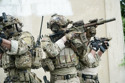 Preview: Soldier in full US MARSOC armed with assault rifle run through the abandoned building. Military