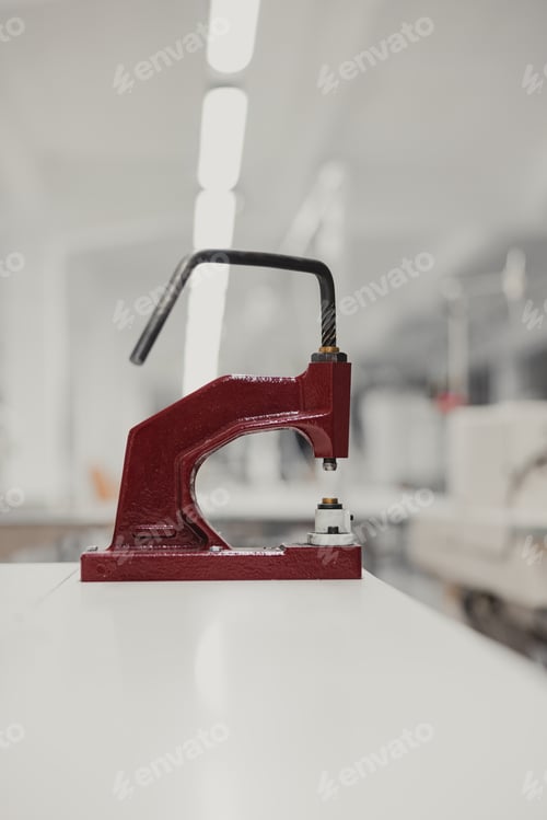 Preview: Close-up of a red mold on a white table in a factory