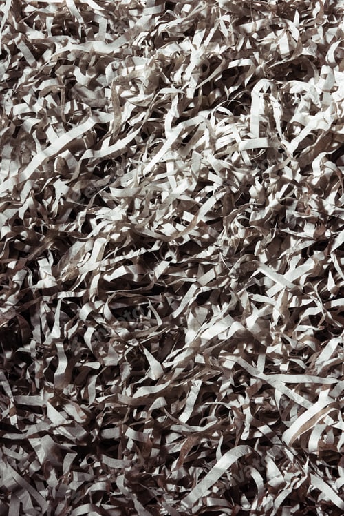 Preview: full frame of grey paper confetti as backdrop