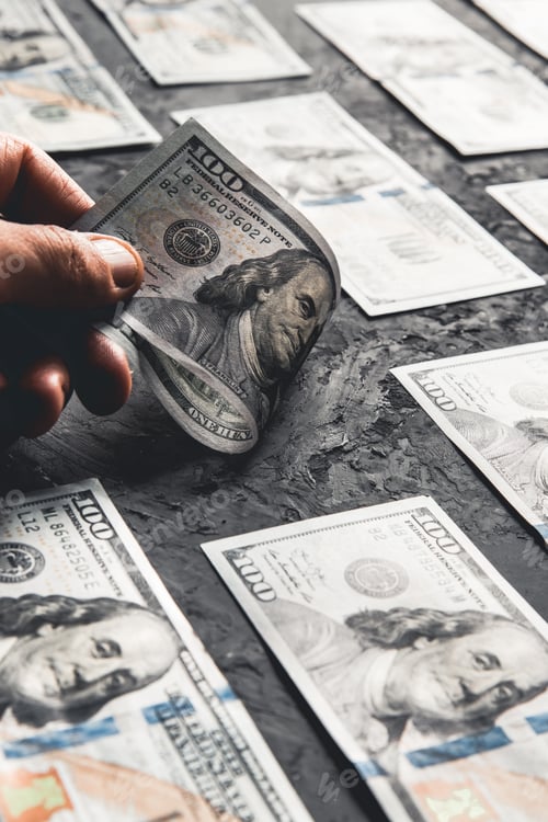 Preview: One hundred dollar bills are creatively laid out. Business concept, development perspective.
