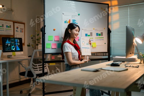 Preview: Professional woman presenting business analytics during virtual meeting at sleek workspace