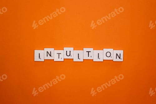 Preview: Intuition scrabble letters word on a orange background