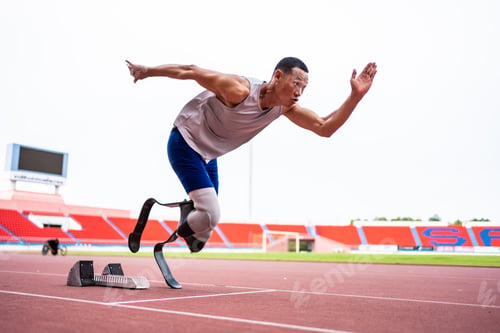 Preview: Asian para-athletes disabled with prosthetic blades running at stadium.