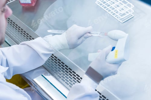 Preview: Cancer research laboratory, scientist preparing cells for centrifuge using an electronic pipette