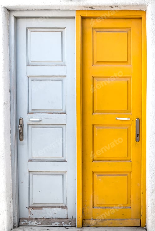 Preview: Rustic white and yellow doors of Greek island