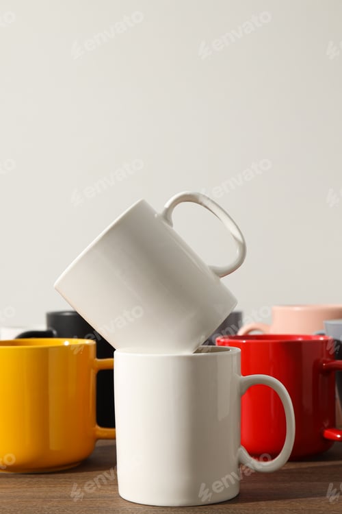 Preview: Multicolored beautiful cups on a light background