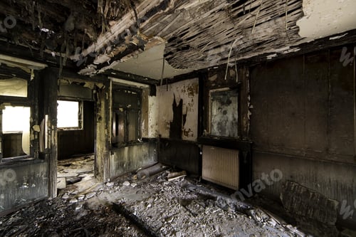 Preview: Inside shot of an abandoned destroyed building with burned walls and worn-out doors
