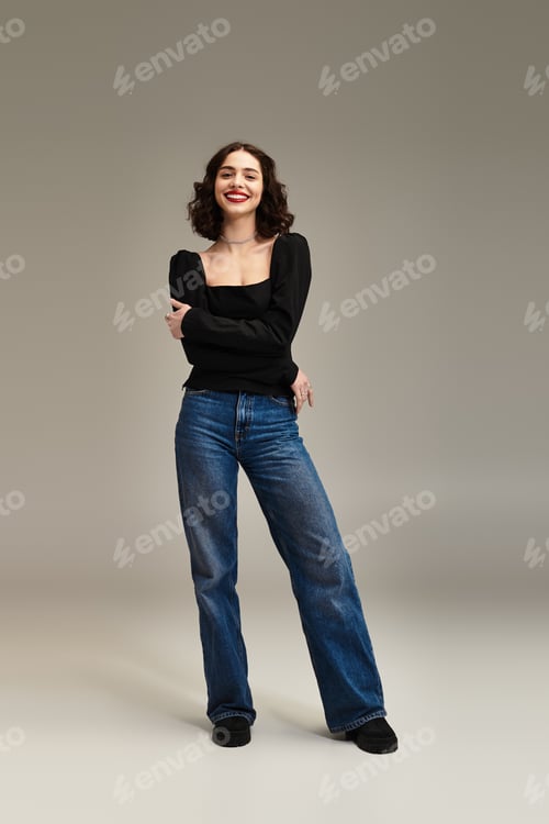 Preview: Confident young woman with braces and red lips stands out against grey backdrop