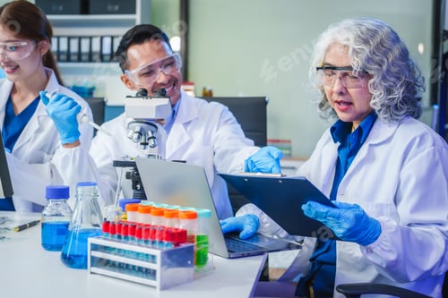 Preview: Two Asian men and women sit at a table in a laboratory, conducting research on liquids. They use