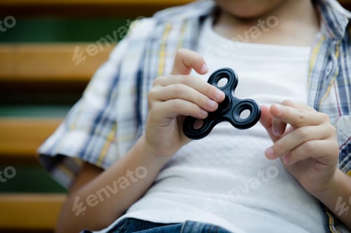Preview: Happy little boy playing in the park at the day time.