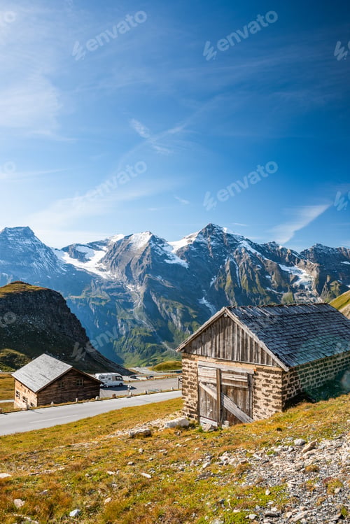 Preview: Wooden Hut at High Alpine Road with Mountains in Background, Aus